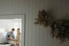 A newborn baby is cuddled by her parents at their home in Rockhampton.