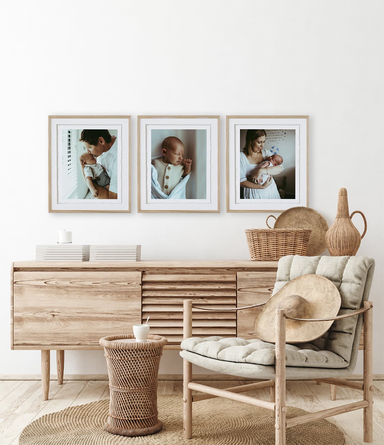 Home interior background, room with minimal decor, 3d render A set of three frames hangs on the wall with photos of a newborn baby in them.