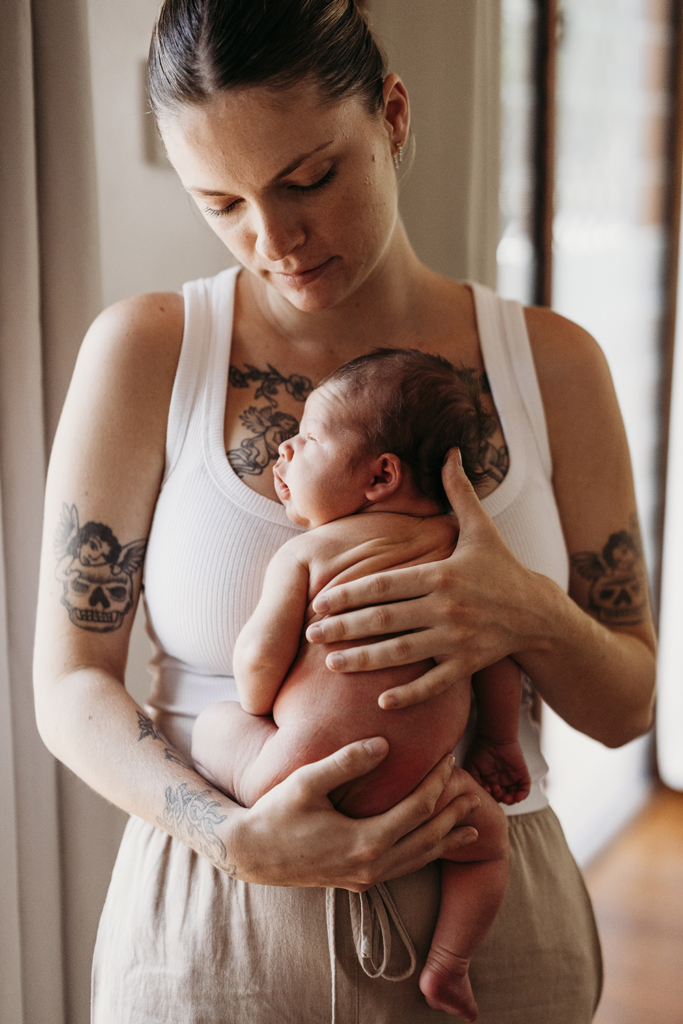 A mother has skin-on-skin time with her newborn baby.