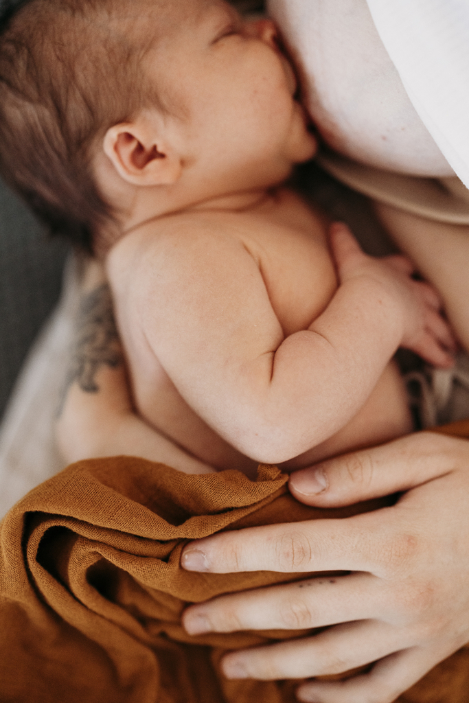 A baby breastfeeds.