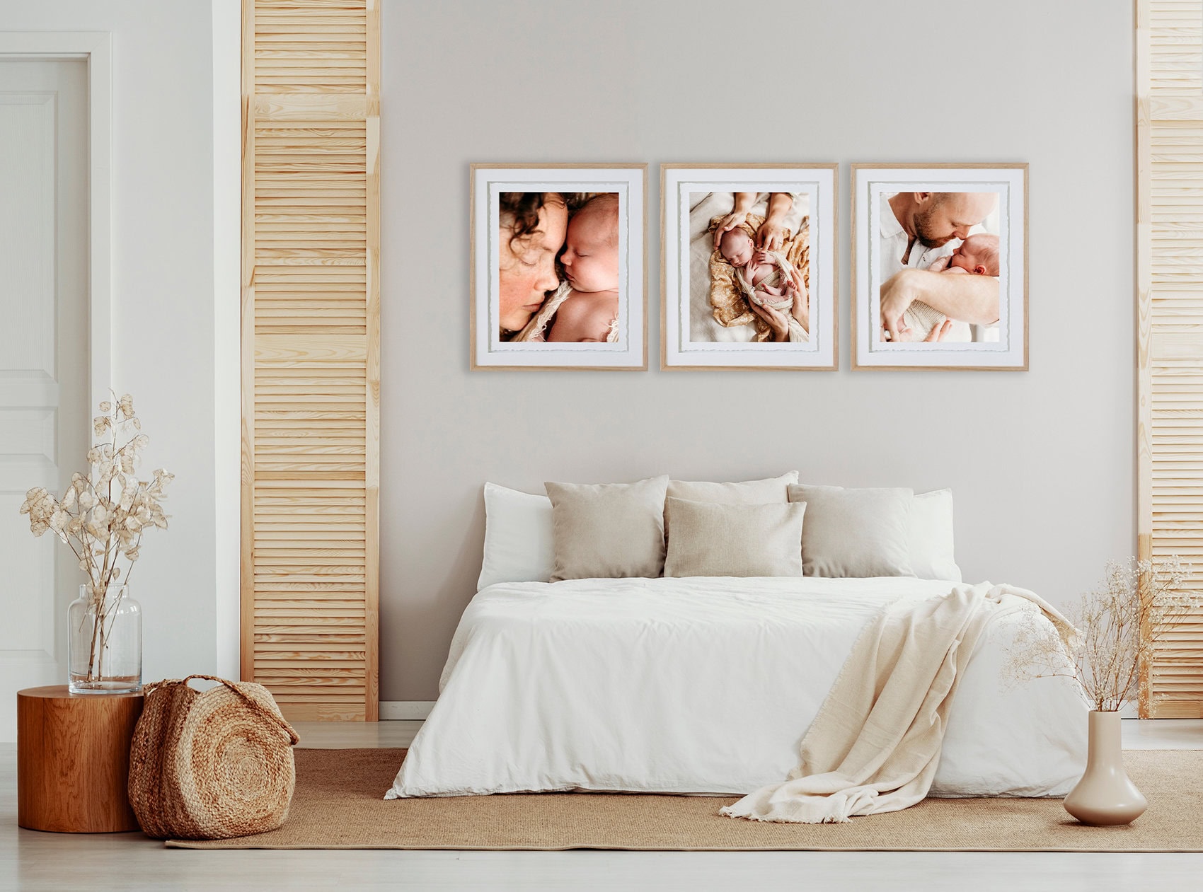 Newborn studio portraits fine art frames A beige bedroom has fine art portraits hanging above it of a newborn studio session.