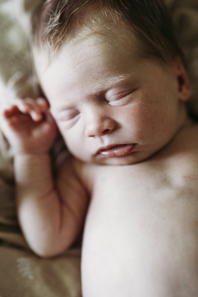 A newborn baby lays asleep in her home in Rockhampton.