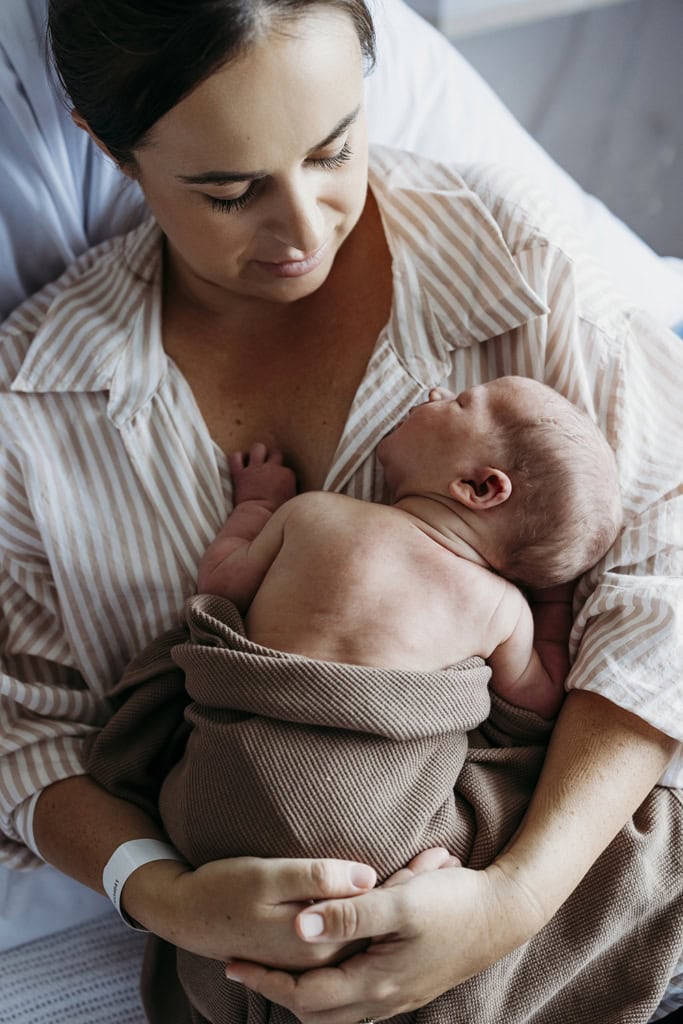 A mother cuddles her newborn baby on her chest at the Rockhampton Mater Hospital