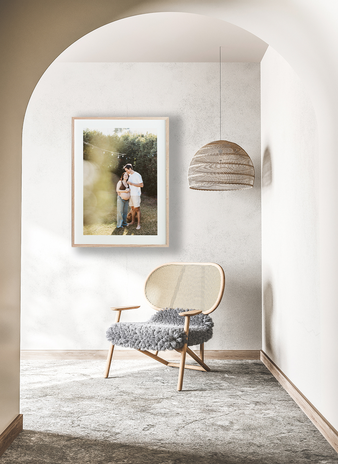 A frame of a Rockhampton couple expecting their first baby hangs above a chair in a hallway.
